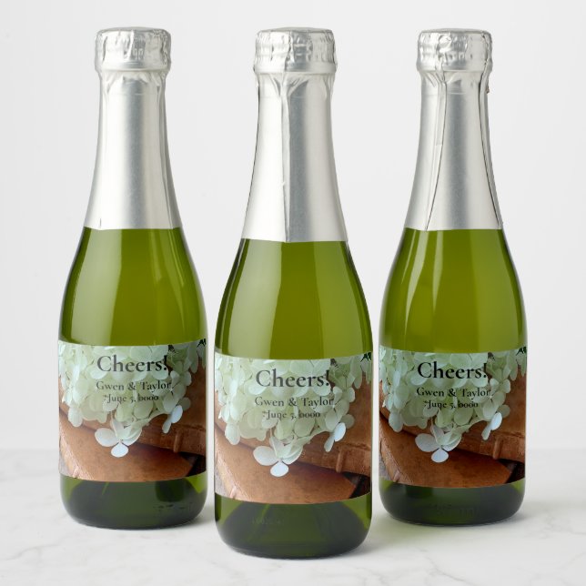 Fresh hydrangeas on old books sparkling wine label (Bottles)