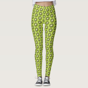 Fresh kiwi fruit background. Round slices pattern Leggings