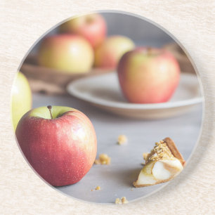 Fresh red apples on the table, apple pie crumbs coaster