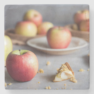 Fresh red apples on the table, apple pie crumbs stone coaster