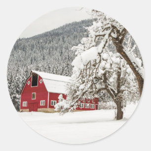 Fresh snow on red barn classic round sticker