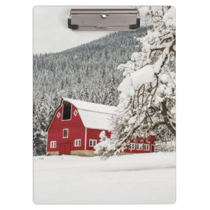 Fresh snow on red barn clipboard