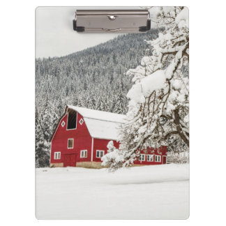 Fresh snow on red barn clipboard