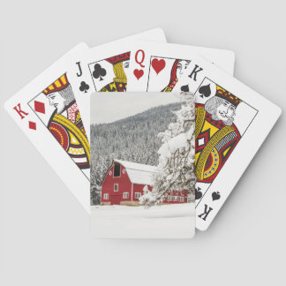 Fresh snow on red barn playing cards