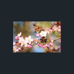 Fresh Sunlit Sakura Flowers And Purple Buds Canvas Print<br><div class="desc">Delicate sakura flowers, Japanese cherry blossoms on a tree twig. Purple buds. The beginning of blossoming in the spring garden. The delightful beauty of the spring season. An extra-large digital painting from a photograph. Awesome floral stretched canvas print to decorate your place or to be used as a gift on...</div>