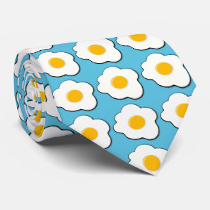 fried eggs for breakfast with blue background tie