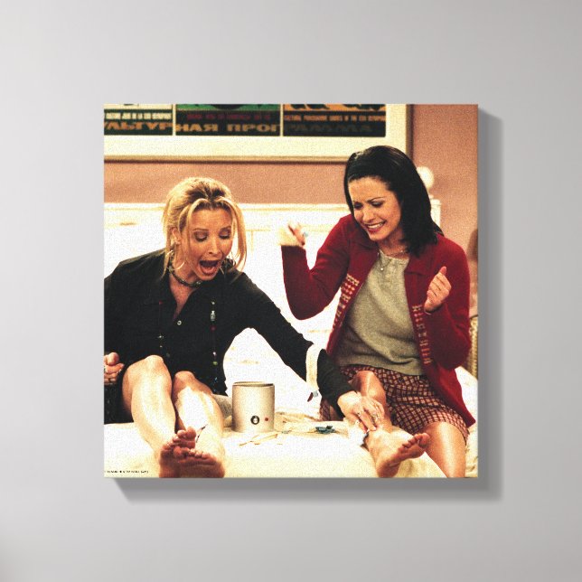 FRIENDS™ | Phoebe & Monica Waxing Legs Canvas Print (Front)
