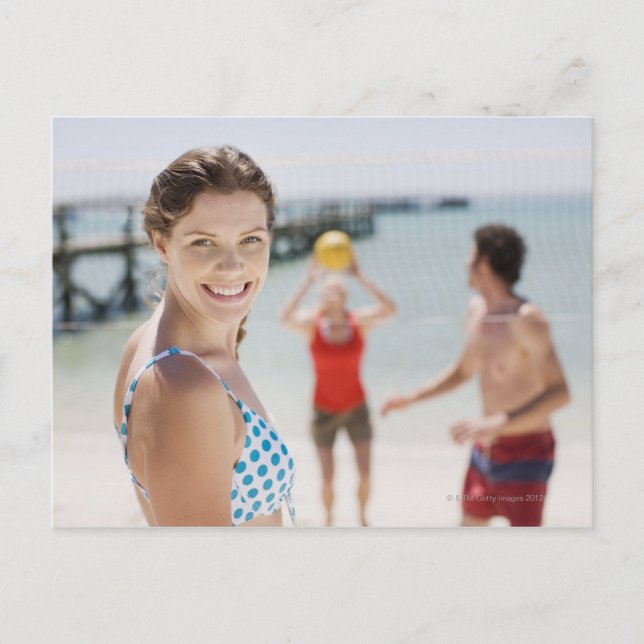 Friends playing volleyball at beach postcard (Front)