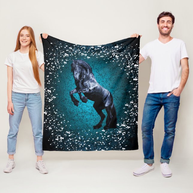Friesian horse, black stallion, snow, blue fleece blanket (In Situ)