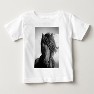 Friesian stallion in the wind. baby T-Shirt