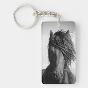 Friesian stallion in the wind. key ring