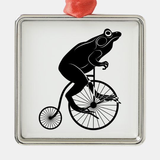 frog riding bicycle