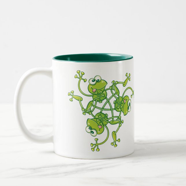 Frogs waving and having fun in a pattern design Two-Tone coffee mug (Left)