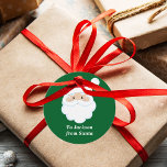 From Santa Cute Custom Green Kids Christmas Gift Favour Tags<br><div class="desc">Customise these cute Santa Claus round gift tags with your own personalised text with your kids name in white script. Santa's red hat and white beard are the perfect holiday drawing on this pretty green gift tag for your presents.</div>