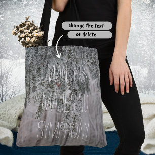 Frosted branches and a snow-covered forest tote bag
