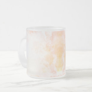 Frosted glass mug with a subtle pinkish-orange