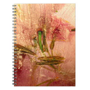 Frozen flowers and leaves. Blossoms in the ice cub Notebook