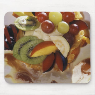 Fruit salad with ice cream. mouse mat