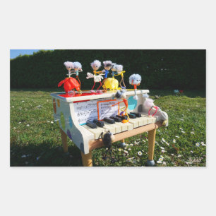 Fubbies on the piano making and dancing music. rectangular sticker