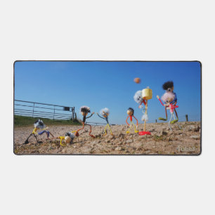 Fubbies who win or lose corfballs. desk mat