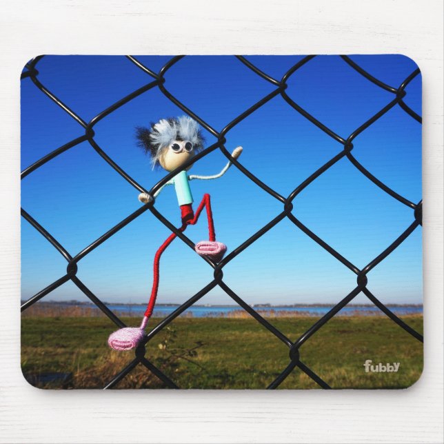 Fubby puppet climbing up the fence. mouse mat (Front)
