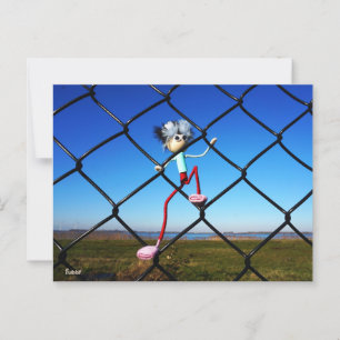 Fubby puppet climbing up the fence. postcard
