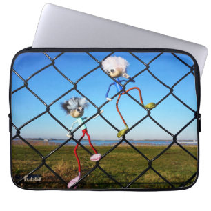 Fubby's climbing a fence. laptop sleeve