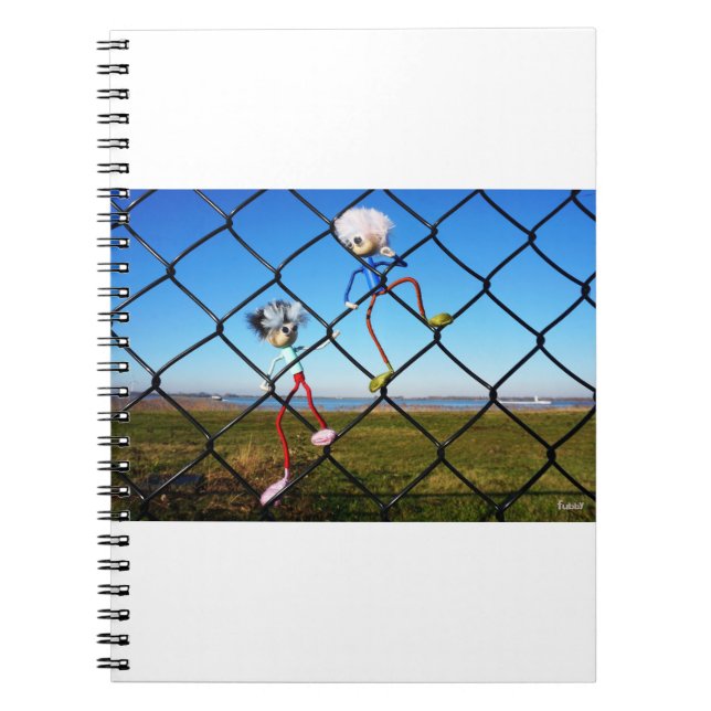 Fubby's climbing a fence. notebook (Front)