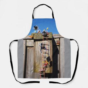 Fubby's in a birdhouse with a rope ladder. apron