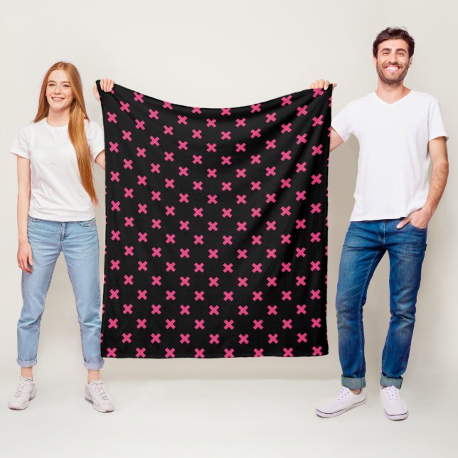 Fuchsia cross stitches on black fleece blanket (In Situ)