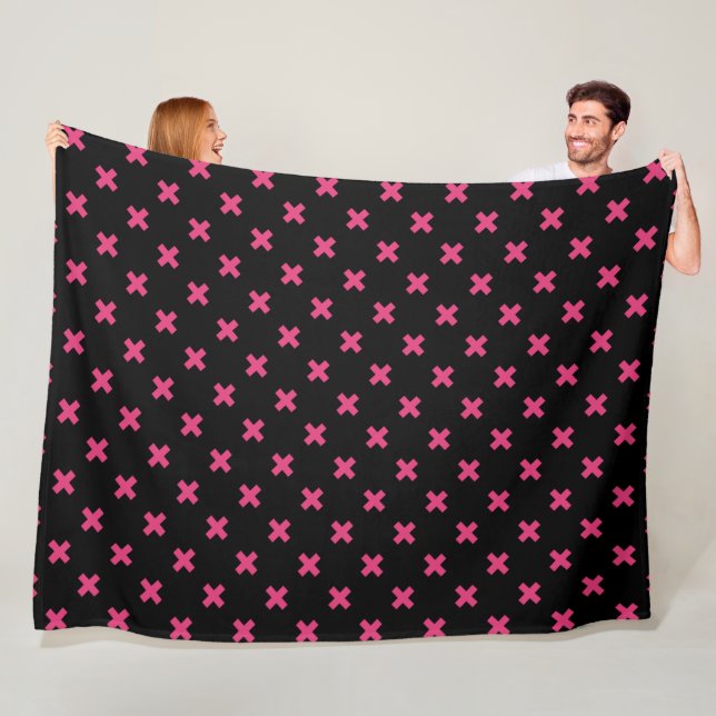 Fuchsia cross stitches on black fleece blanket (In Situ)