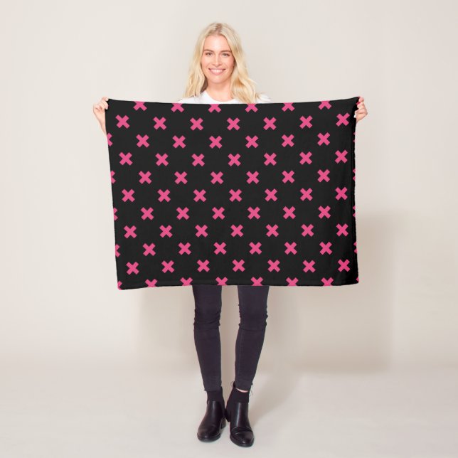 Fuchsia cross stitches on black fleece blanket (In Situ)