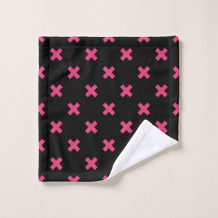 Fuchsia cross stitches on black wash cloth