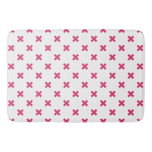 Fuchsia cross stitches on white bath mat
