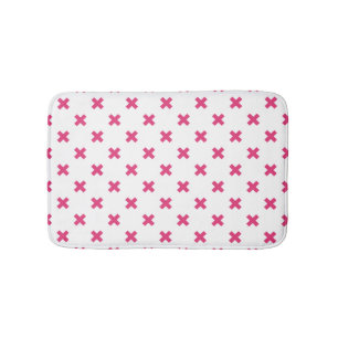 Fuchsia cross stitches on white bath mat