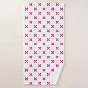 Fuchsia cross stitches on white bath towel
