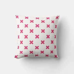 Fuchsia cross stitches on white cushion
