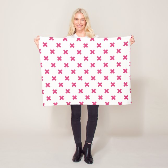 Fuchsia cross stitches on white fleece blanket (In Situ)