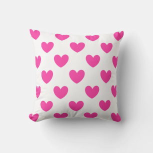 Fuchsia pink polka hearts on white cushion