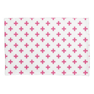 Fuchsia polka crosses on white pillowcase