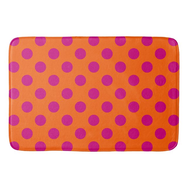Fuchsia polka dots on orange bath mat (Front)