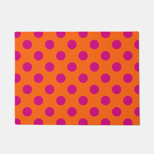 Fuchsia polka dots on orange doormat