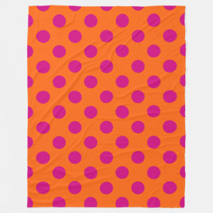 Fuchsia polka dots on orange fleece blanket