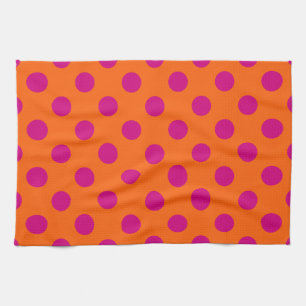 Fuchsia polka dots on orange tea towel