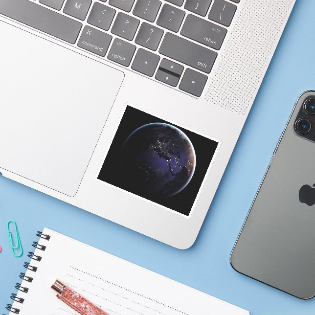 Full Earth Showing City Lights Of Europe At Night. (Laptop w/ iPhone)