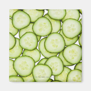 Full frame of sliced cucumber, on white magnet
