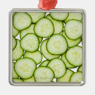 Full frame of sliced cucumber, on white metal tree decoration