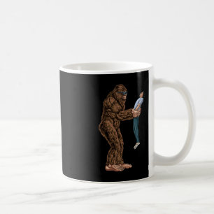 Fun Bigfoot Found A Guy And Picked Him Up - Sasqua Coffee Mug