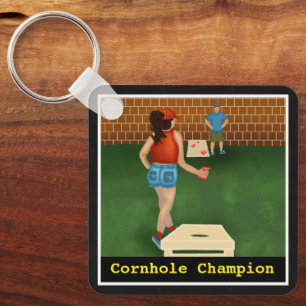 Fun Couple Playing a Game Of Cornhole   Champion Key Ring