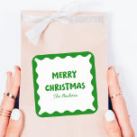 Fun Retro Wavy Green Trendy Custom Chic Christmas Square Sticker<br><div class="desc">Add a touch of playful nostalgia to your holiday festivities with this retro-inspired Christmas sticker! The bold green and white colour palette, paired with a chic scalloped border, creates a classic yet joyful design that catches the eye. Personalise it with your family name for a unique holiday accent, perfect for...</div>
